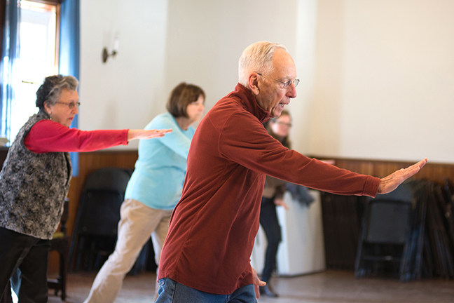 Gary Girard leads a morning Tai Chi class.